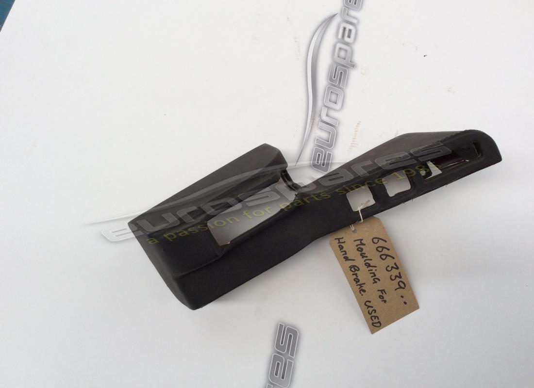 MOLDURA Ferrari USADA PARA PALANCA DE FRENO DE MANO. NÚMERO DE PIEZA 666339.. (1)