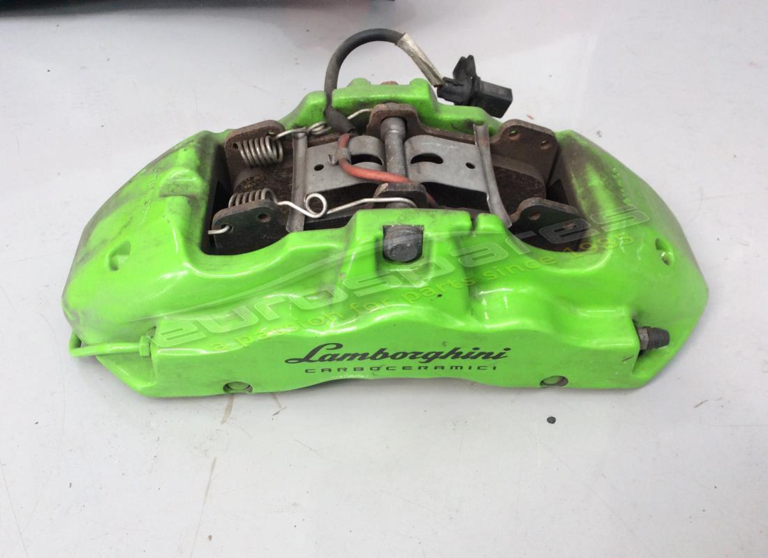 used lamborghini front caliper in green. part number 4t0615106cf (1)