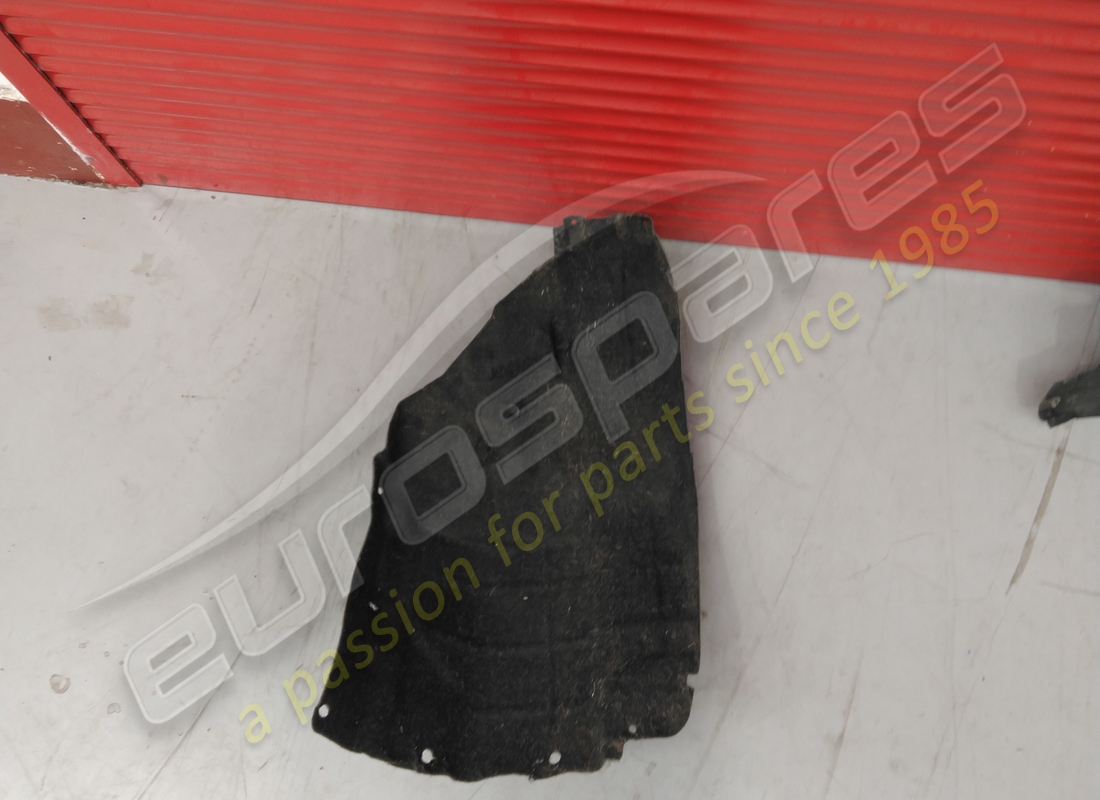 DAMAGED MASERATI LH FRONT WHEELHOUSE GUARD . PART NUMBER 670102659 (1)